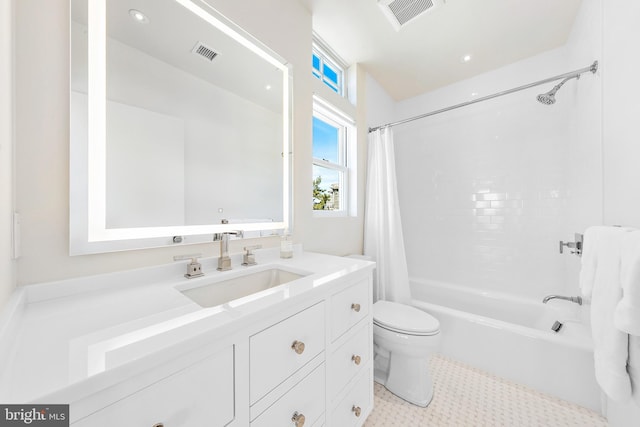 full bathroom featuring vanity, toilet, and shower / bath combo with shower curtain