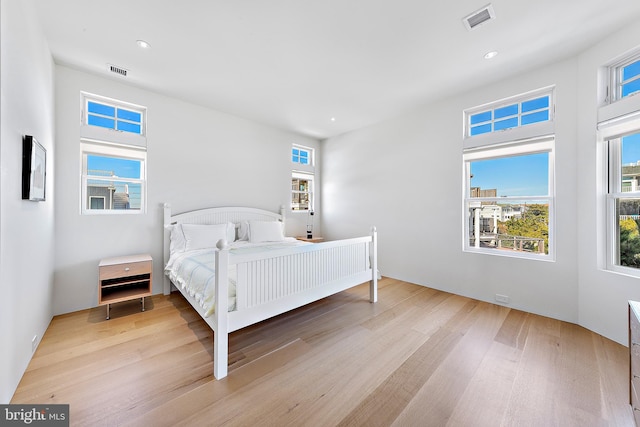 bedroom with light hardwood / wood-style flooring