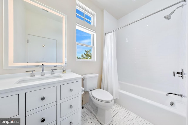 bathroom with shower / tub combo, vanity, and toilet