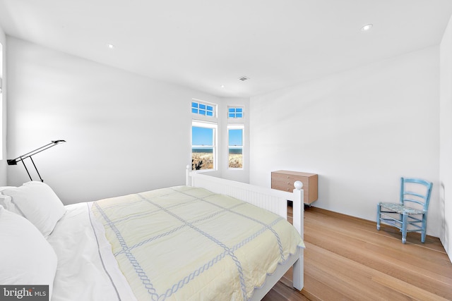 bedroom featuring recessed lighting and light wood-style flooring