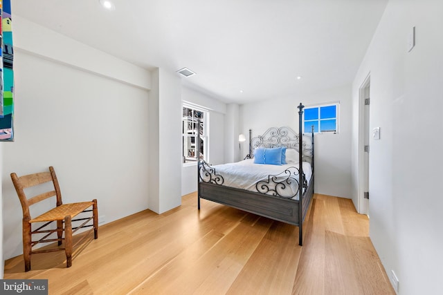 bedroom with visible vents, recessed lighting, and light wood finished floors