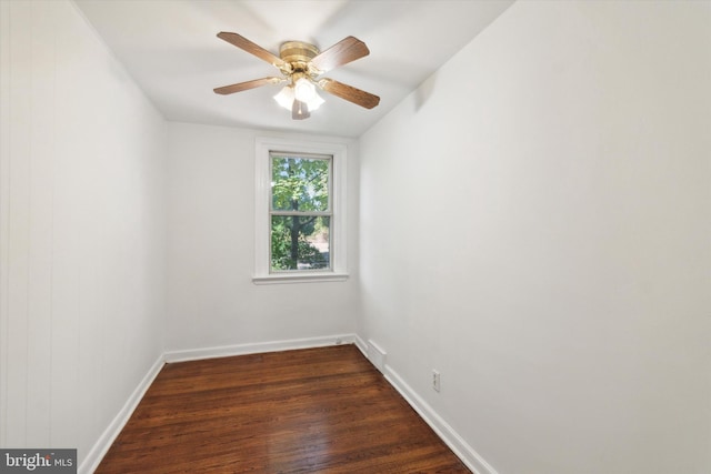 empty room with ceiling fan, lofted ceiling, and dark hardwood / wood-style flooring