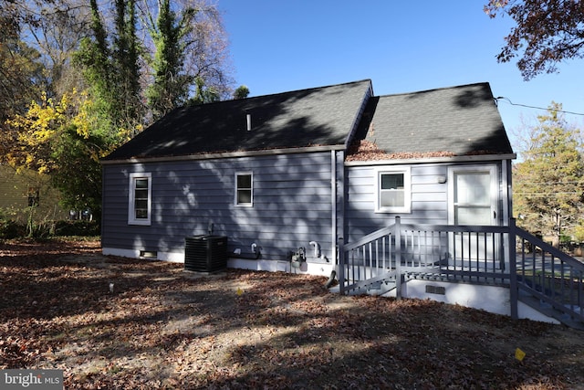 rear view of property featuring cooling unit