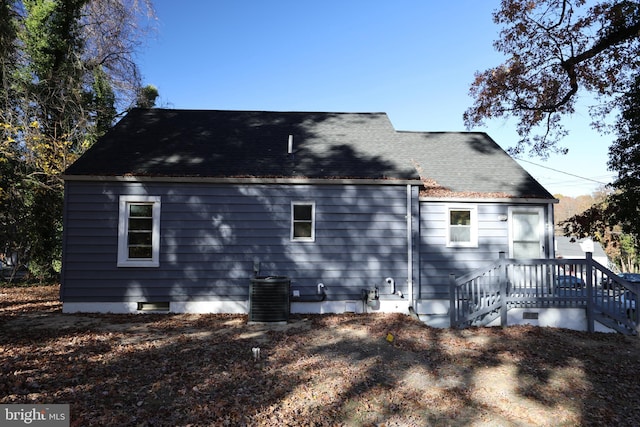 back of house featuring central AC