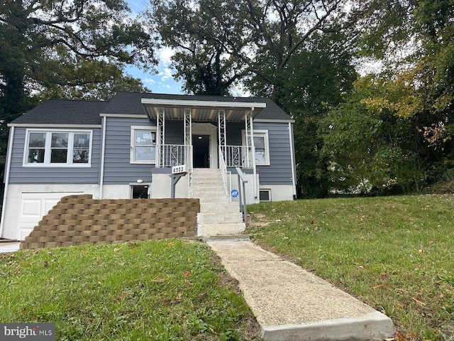 view of front of house with a front lawn and a porch