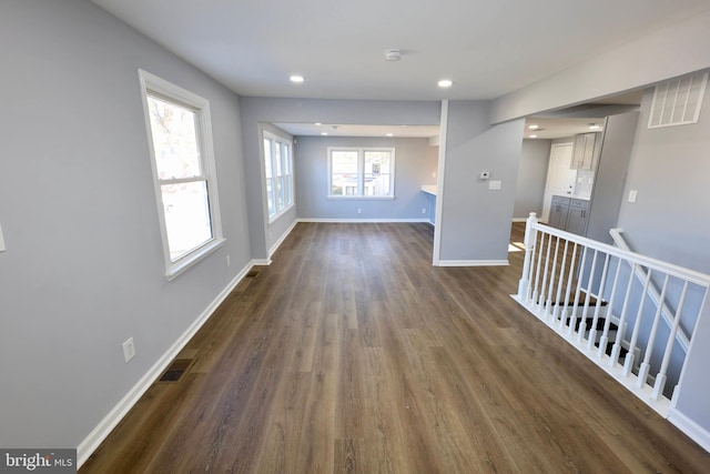 spare room with dark wood-type flooring