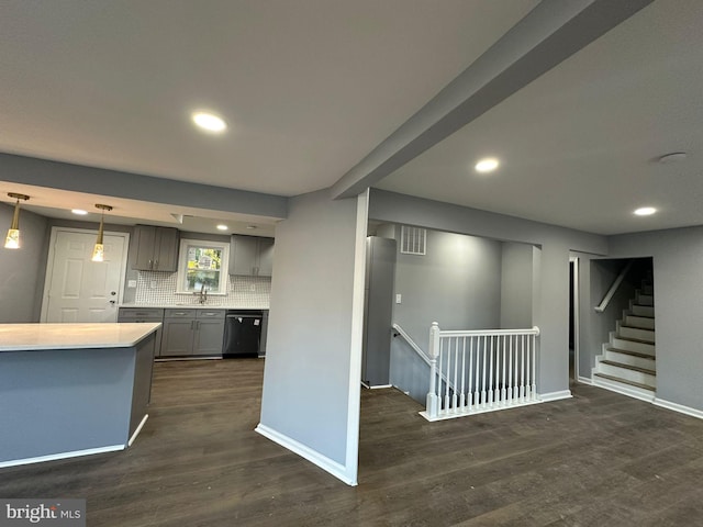 kitchen featuring gray cabinetry, dark wood-type flooring, pendant lighting, and black dishwasher