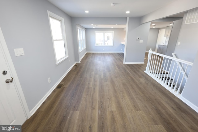 unfurnished room with dark hardwood / wood-style flooring