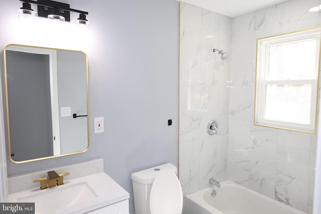 full bathroom featuring vanity, toilet, and tiled shower / bath combo