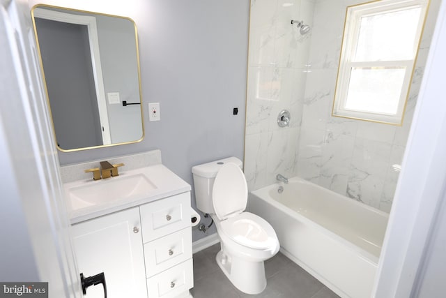 full bathroom with tile patterned flooring, vanity, tiled shower / bath combo, and toilet