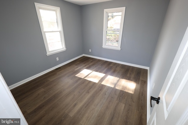 empty room featuring dark hardwood / wood-style floors