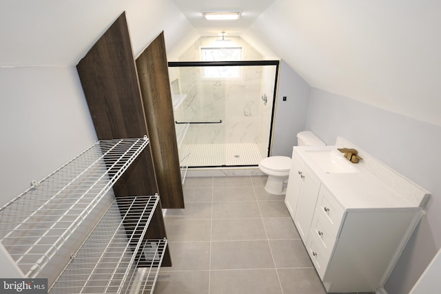 bathroom featuring an enclosed shower, vanity, tile patterned flooring, toilet, and lofted ceiling