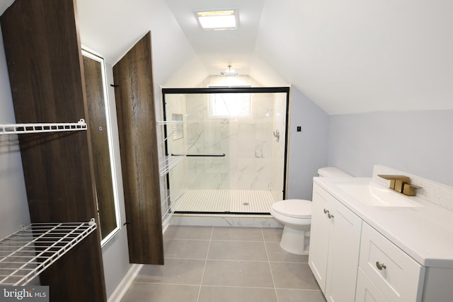 bathroom featuring vanity, lofted ceiling, tile patterned floors, toilet, and an enclosed shower