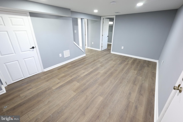 basement featuring hardwood / wood-style flooring