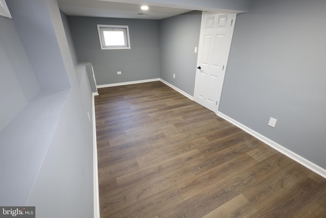 basement featuring dark hardwood / wood-style floors