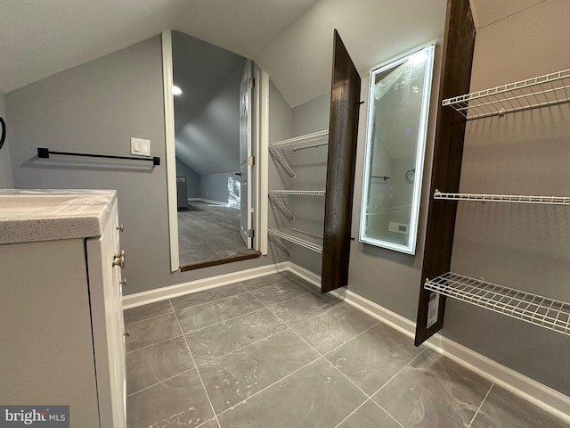 bathroom with vaulted ceiling