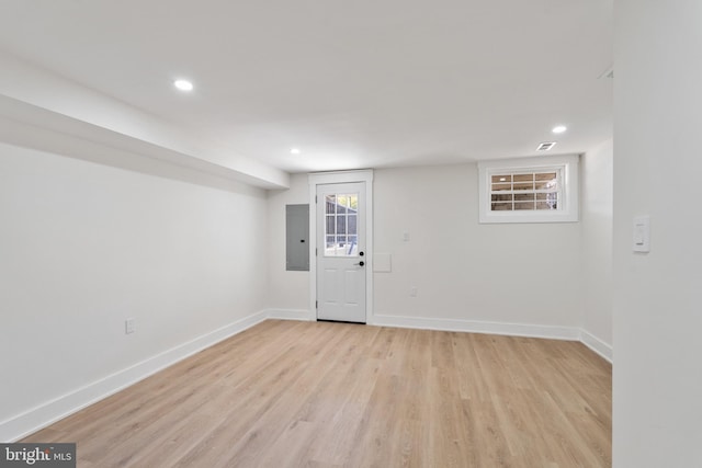 interior space with light hardwood / wood-style floors and electric panel