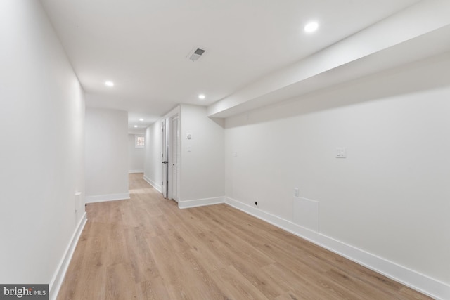 basement featuring light wood-type flooring