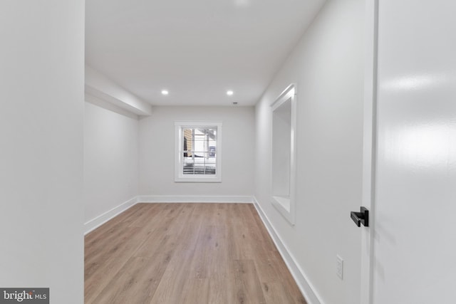 spare room with light hardwood / wood-style flooring