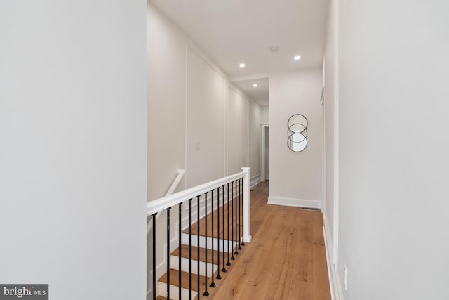 hall with light hardwood / wood-style flooring