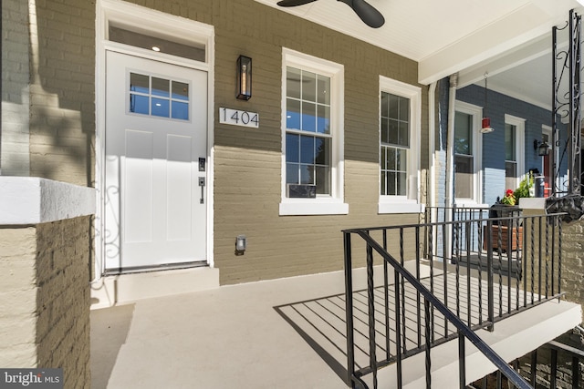 view of exterior entry with a porch