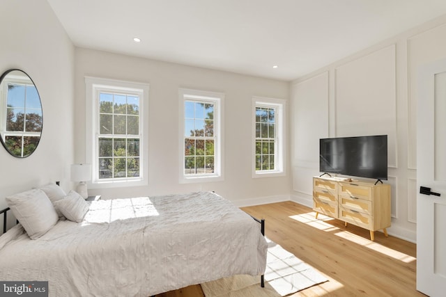 bedroom with light hardwood / wood-style floors