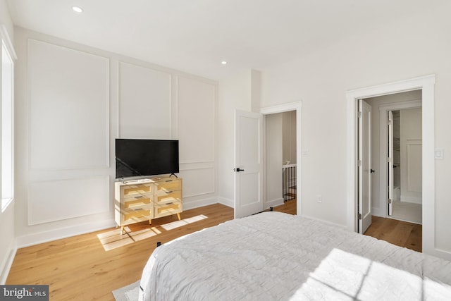 bedroom featuring hardwood / wood-style flooring