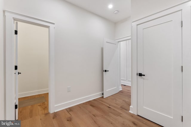 hall with light hardwood / wood-style floors