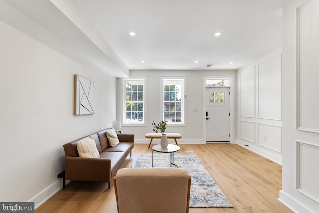 living room with light hardwood / wood-style flooring