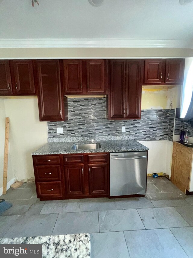 kitchen with stainless steel dishwasher, a sink, tasteful backsplash, crown molding, and dark brown cabinets