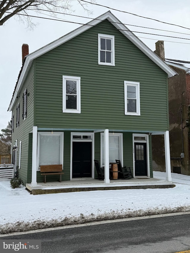 view of front of home featuring a chimney