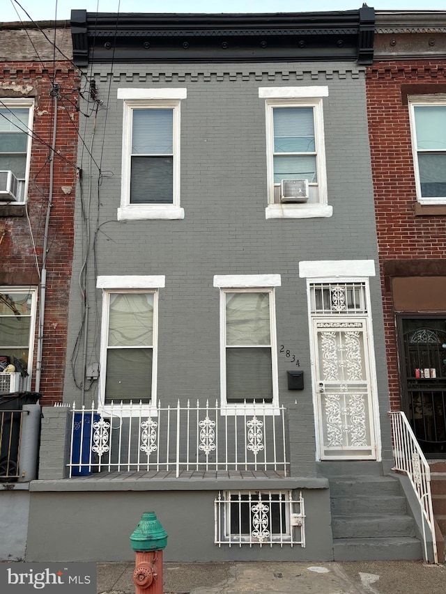 view of front of property featuring cooling unit