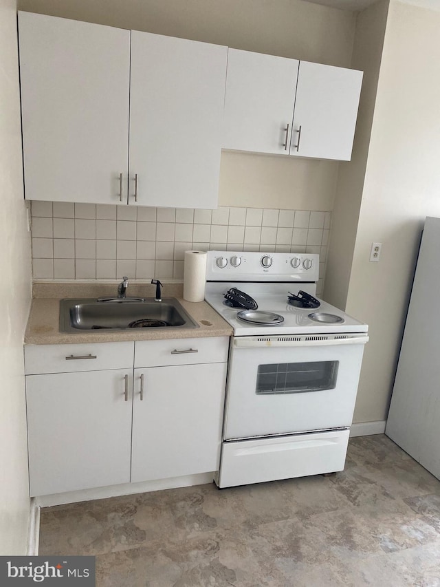 kitchen featuring decorative backsplash, white cabinetry, sink, and electric range