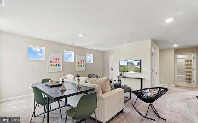 living room featuring light carpet