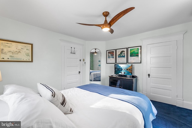 carpeted bedroom featuring ceiling fan