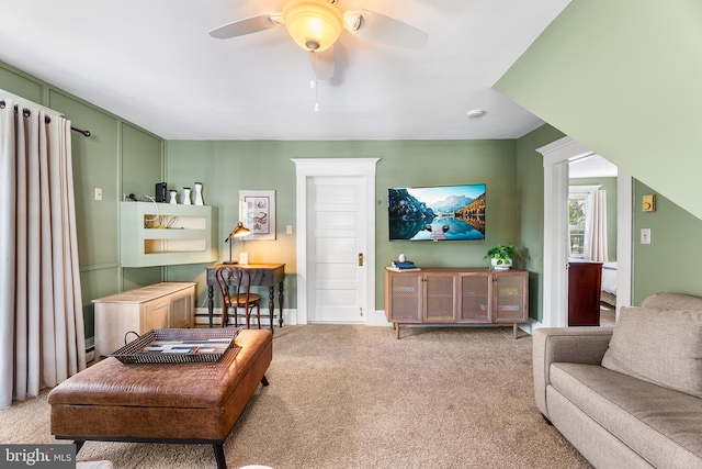 living room featuring light carpet and ceiling fan