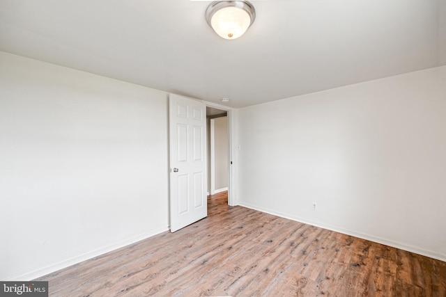 empty room with light hardwood / wood-style floors