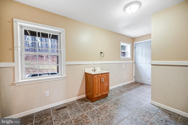 interior space with a wealth of natural light and sink