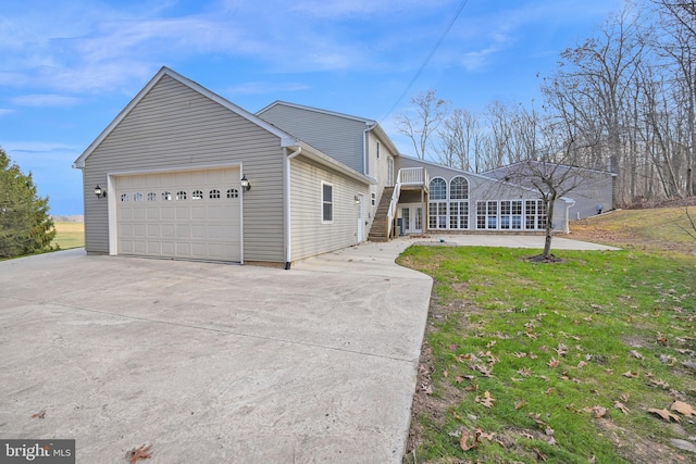 view of front of property with a garage and a front yard