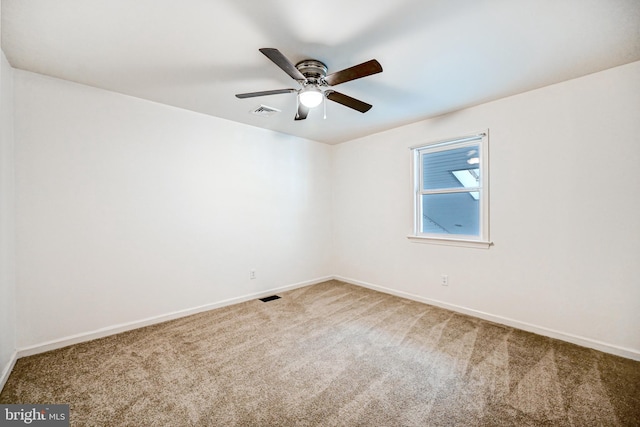 carpeted empty room with ceiling fan