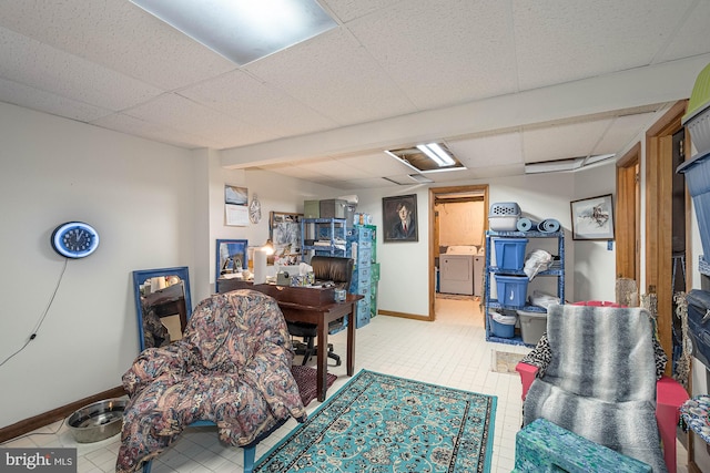 interior space featuring washer / dryer and a drop ceiling