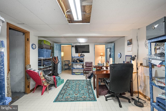 office space featuring a paneled ceiling