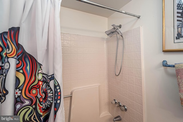 bathroom featuring shower / bath combination with curtain