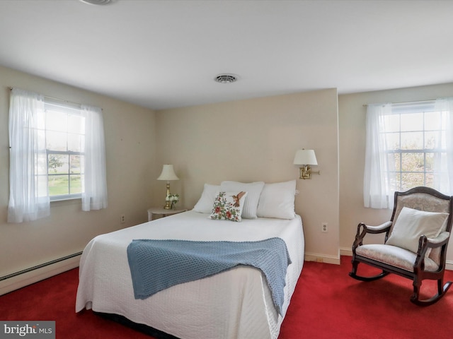 carpeted bedroom with a baseboard radiator