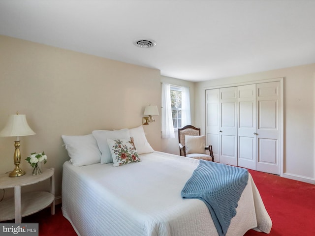 carpeted bedroom featuring a closet