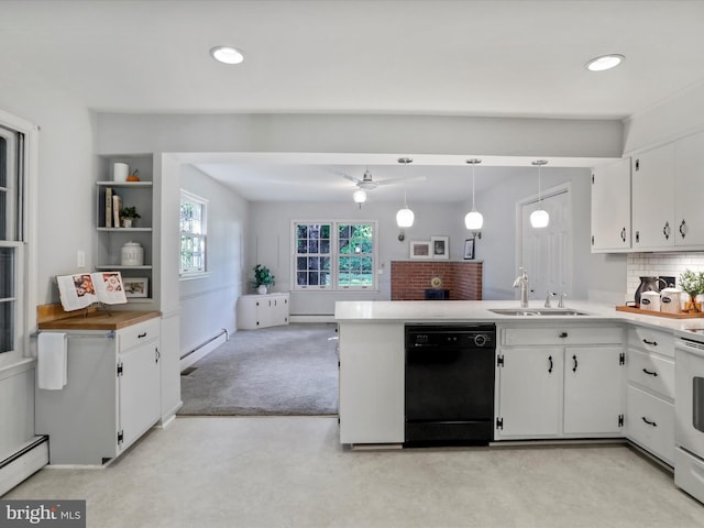 kitchen featuring sink, dishwasher, white cabinetry, light carpet, and pendant lighting