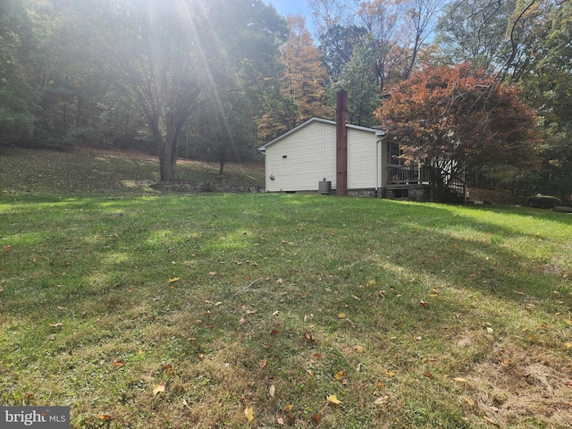 view of yard with central air condition unit