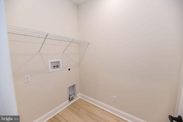 laundry room with washer hookup, wood-type flooring, and electric dryer hookup