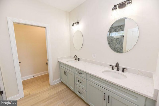 bathroom with vanity and hardwood / wood-style floors