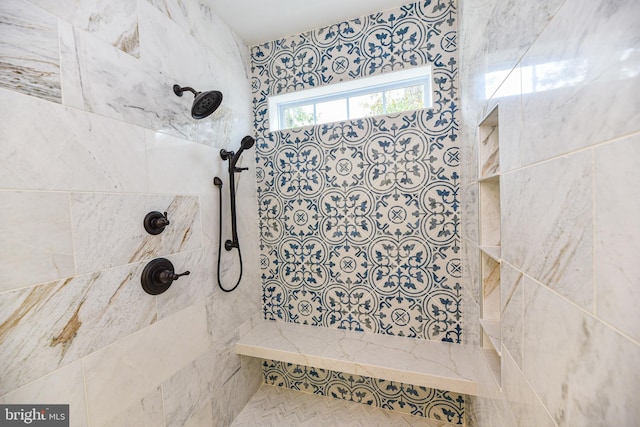 bathroom featuring a tile shower